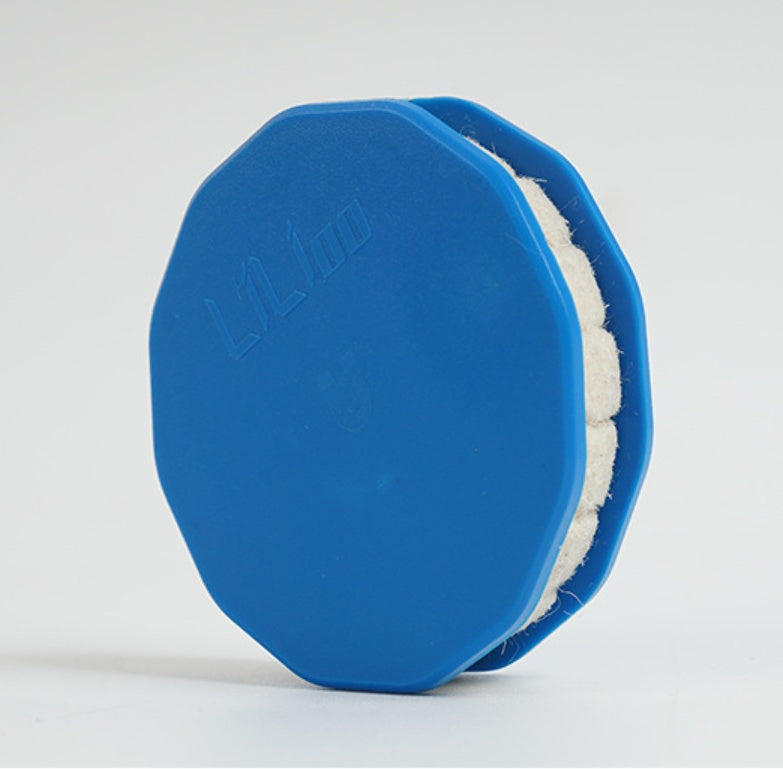 Blue Bicycle Chain Oiler with white pad on a light gray background