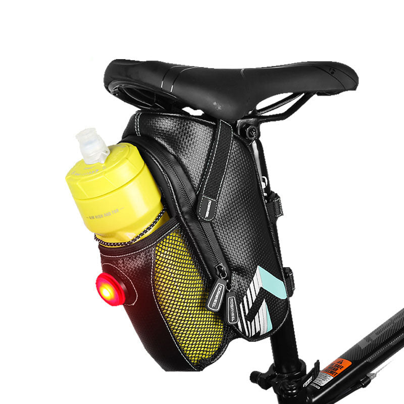Bicycle saddle bag with water bottle holder and yellow water bottle and light on a white background