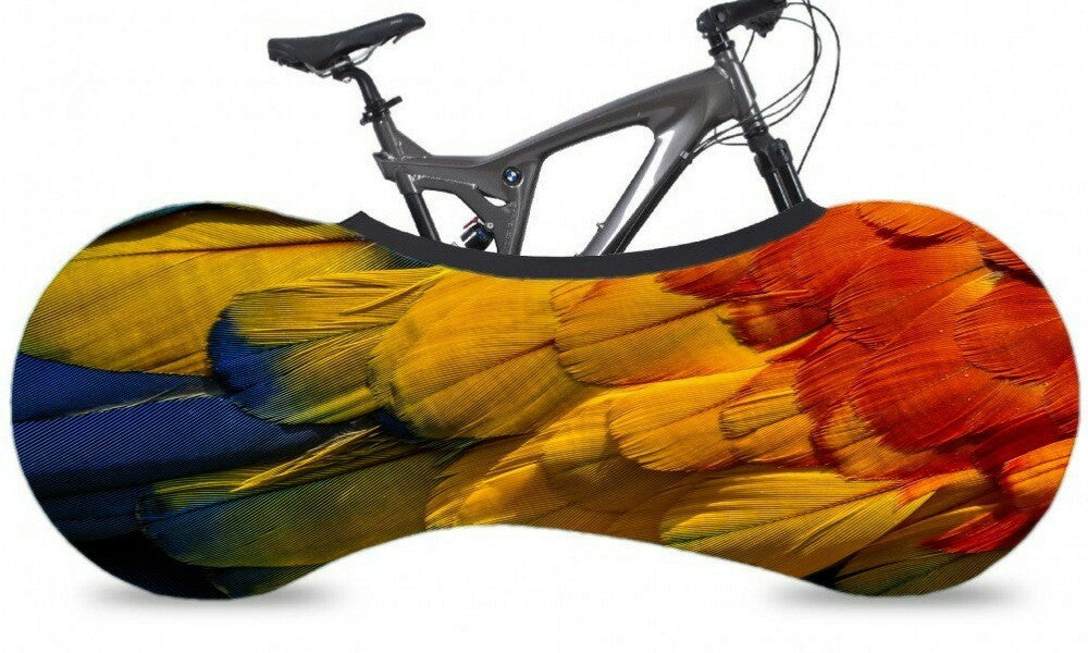 Bicycle with a colorful parrot-like cover design on a white background
