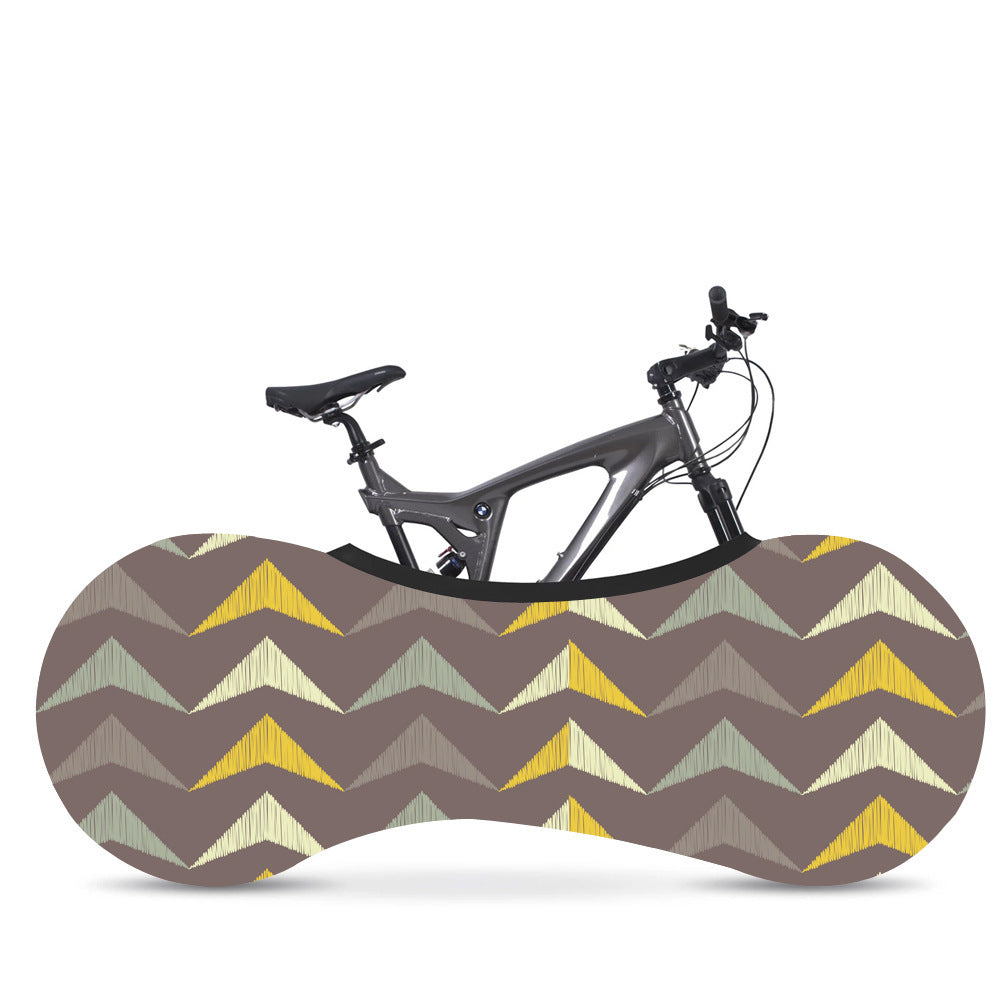 Bicycle in a patterned brown and yellow Elasticated Bicycle Dust Cover against a white background