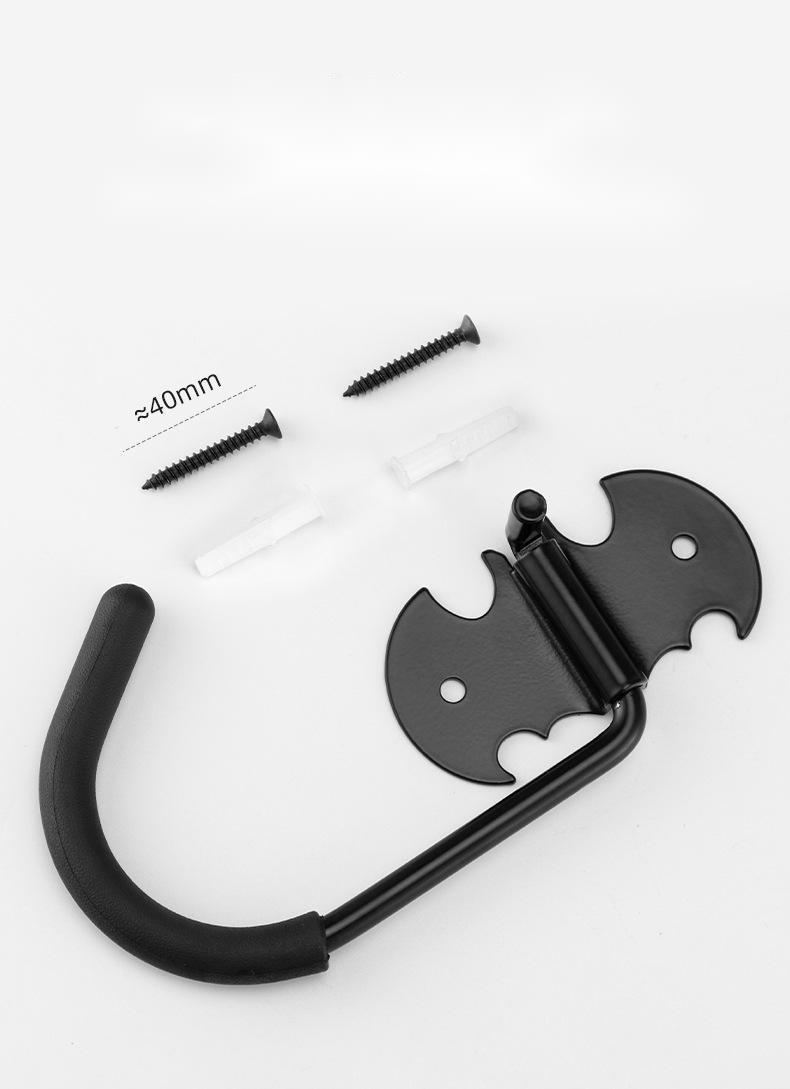 Black metal bicycle storage hook with screws on a white background