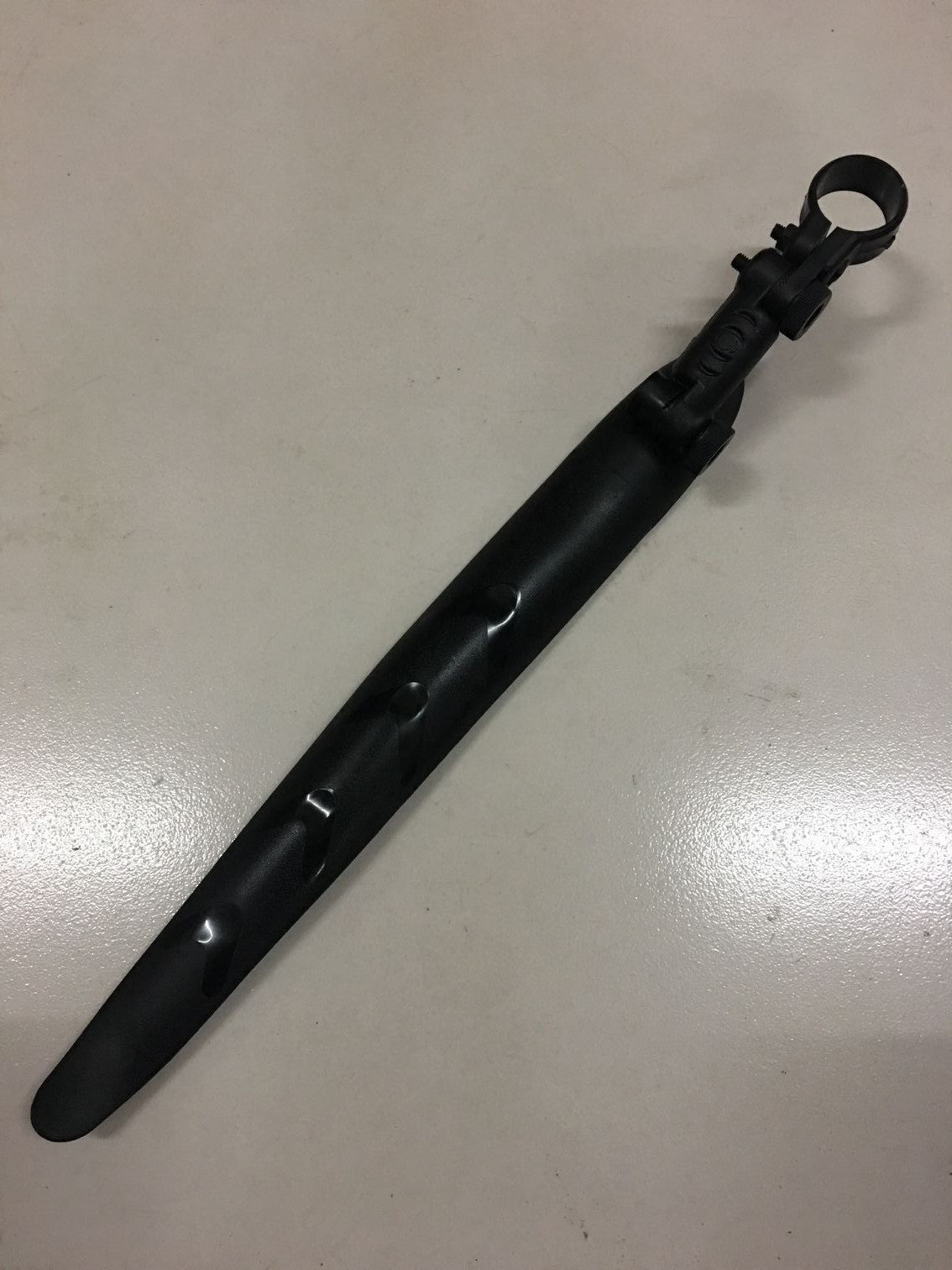 Black Foldable Road Bike Mudguard on a white surface