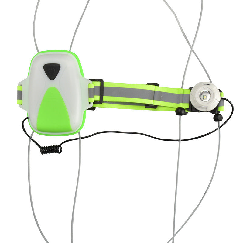 Close-up of green hi-viz cycling vest with integrated LED light on a white background