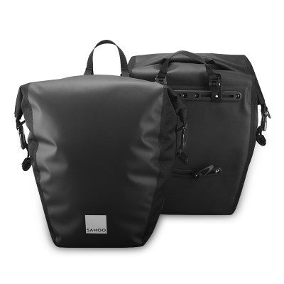 Black bicycle panniers with a visible brand logo on a white background