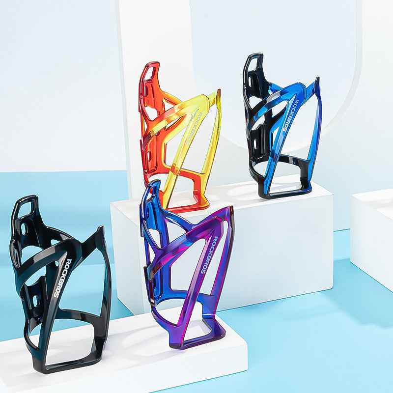 Five colorful bicycle bottle cages on a white and light blue background
