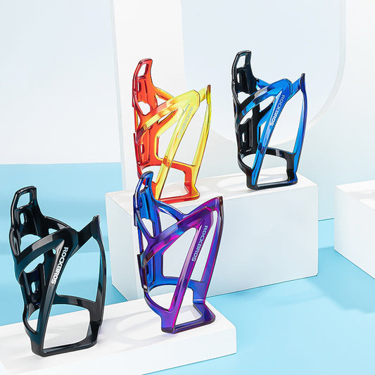 Five colorful bicycle bottle cages on a white and light blue background