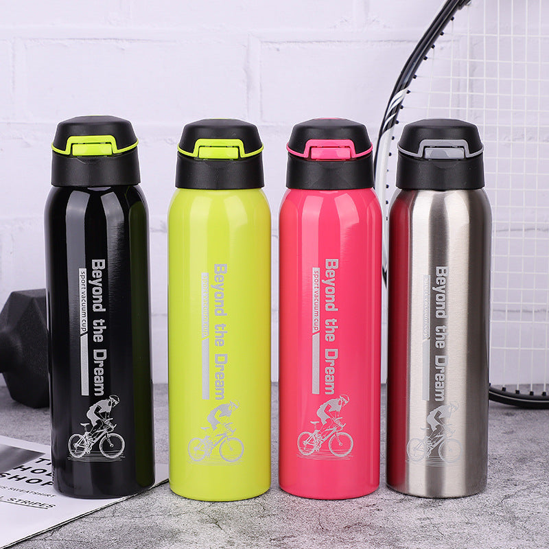 Four coloured thermal bicycle bottles with 'Beyond the Dream' branding on a gray surface.