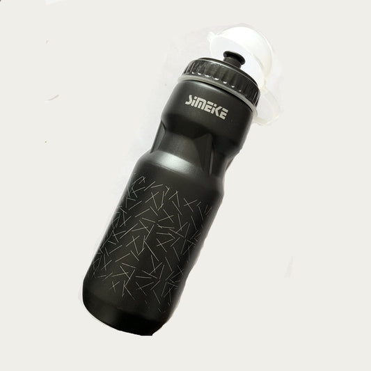 Black bicycle water bottle with black cap on a light gray background