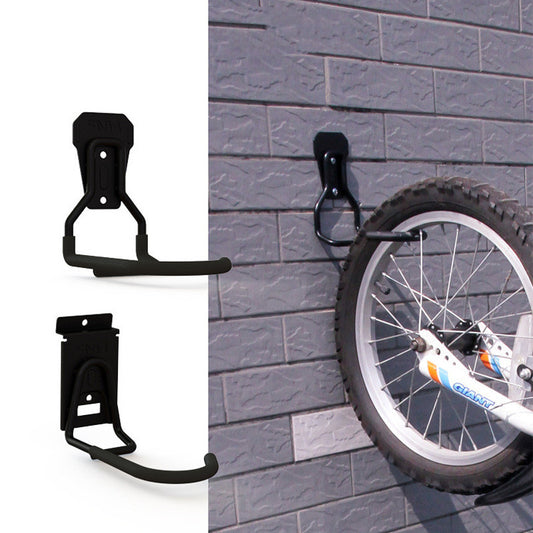 Black bike wheel holder attached to a gray brick wall with a bicycle wheel visible.