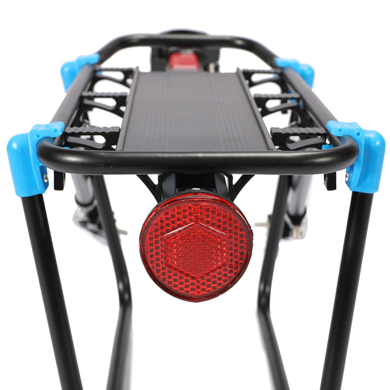 Black bicycle rack with a red reflector on a white background