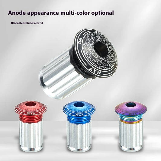 Aluminium alloy handlebar plugs with anodised effect finish on a gray background