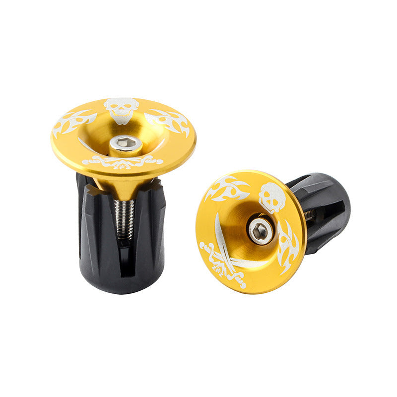 Two yellow and black Aluminum Alloy Bicycle Handlebar Plugs with decorative patterns on a white background