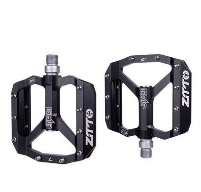 Pair of black bicycle pedals on a white background