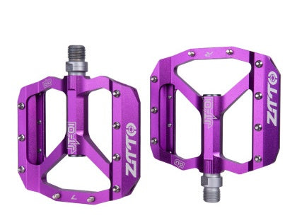 Purple bicycle pedals with branding on a white background