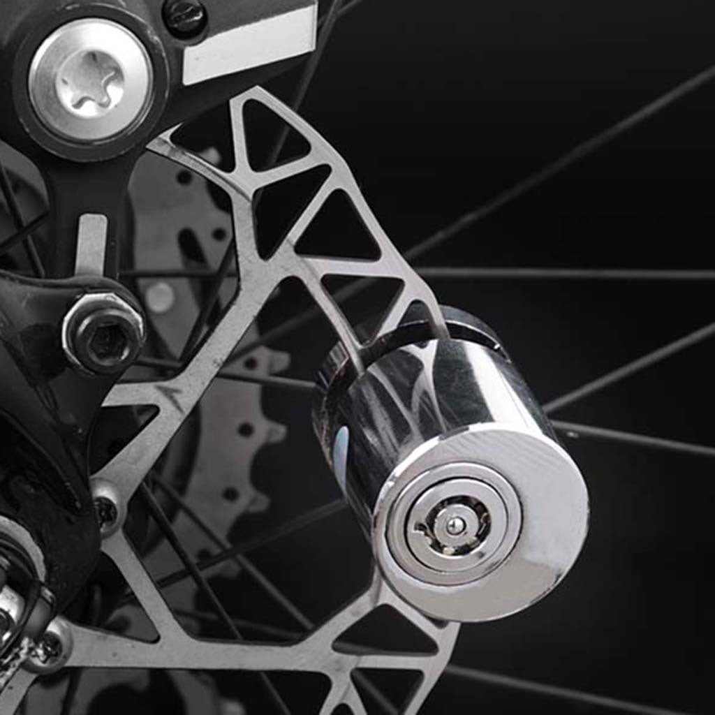 Close-up of a Bicycle Anti-theft Disc Brake Lock and bicycle brake disc with a black background