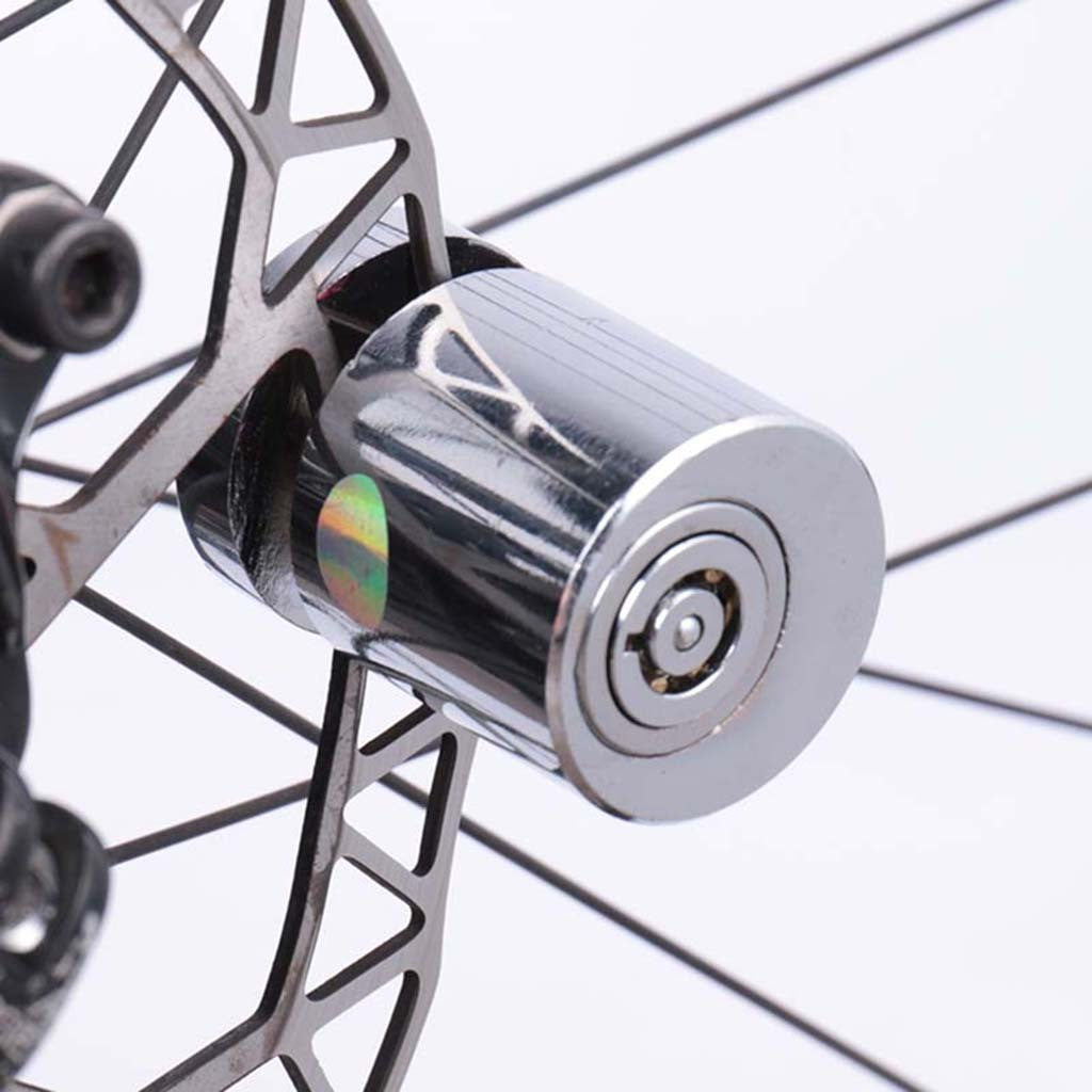 Close-up of a bicycle wheel with a Bicycle Anti-theft Disc Brake Lock on a white background