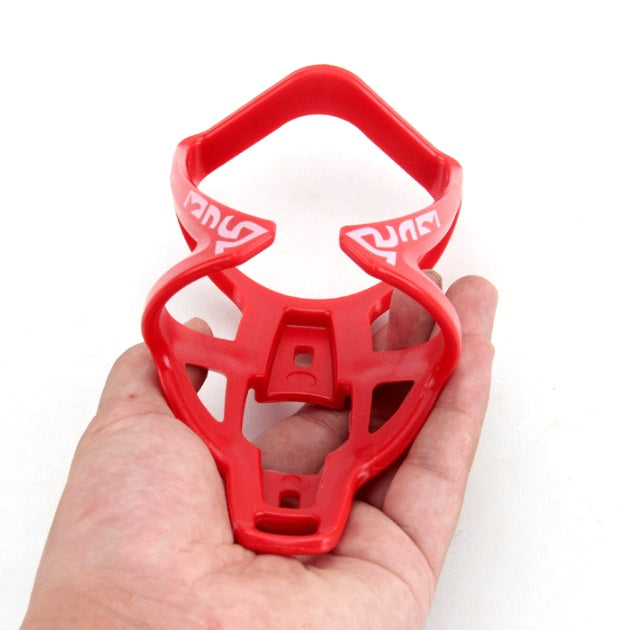 Red bottle holder with brand logo held in a hand against a white background
