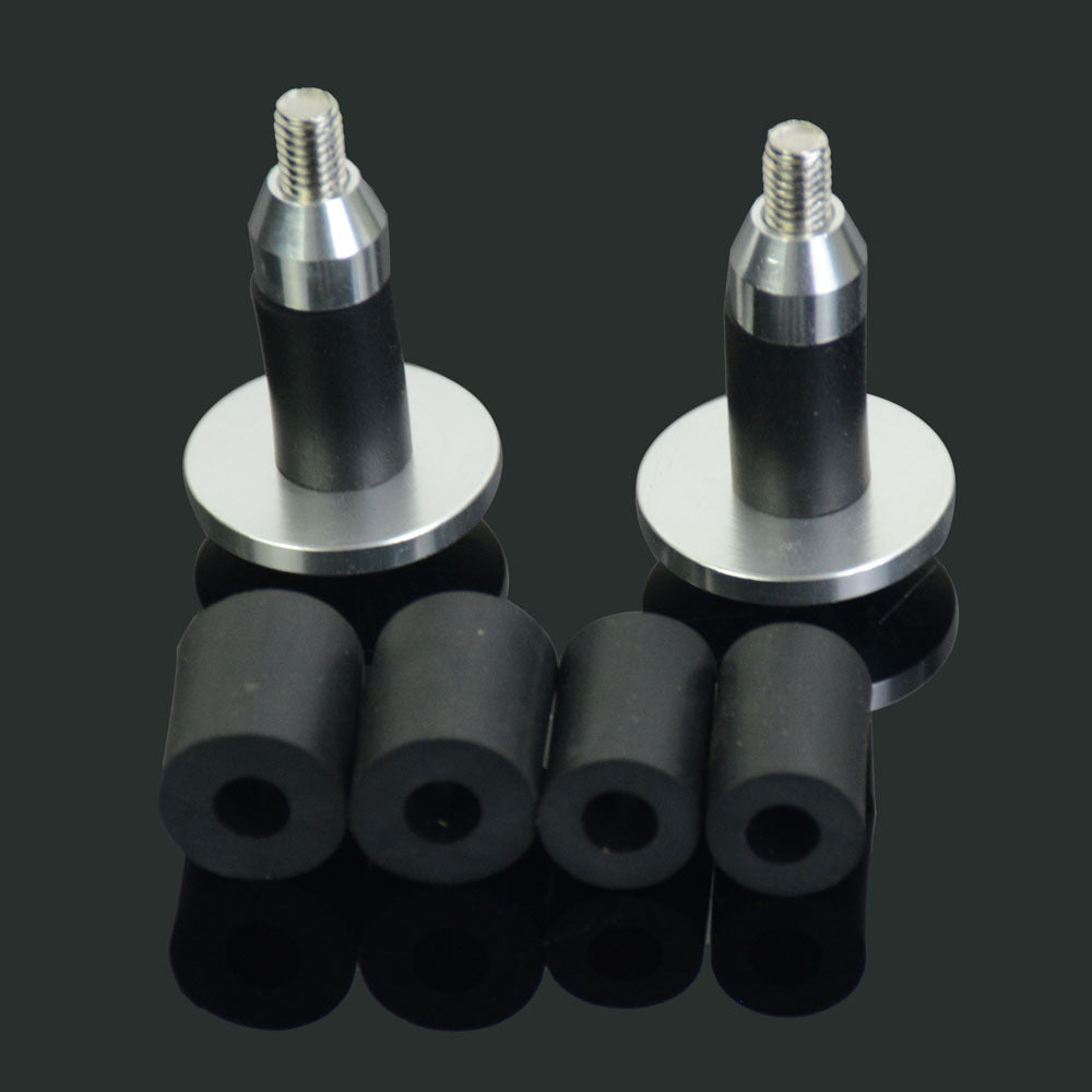 Two aluminium Bicycle Handlebar Plugs on a reflective black surface