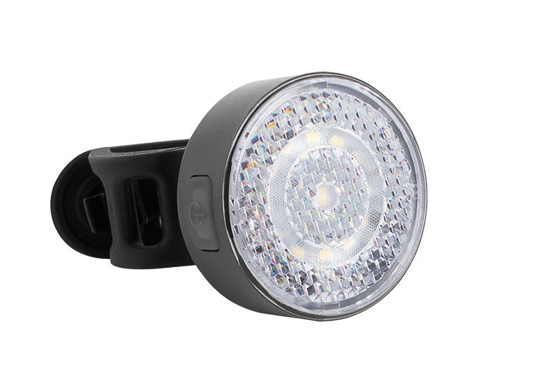 Close-up of a bicycle light on a white background
