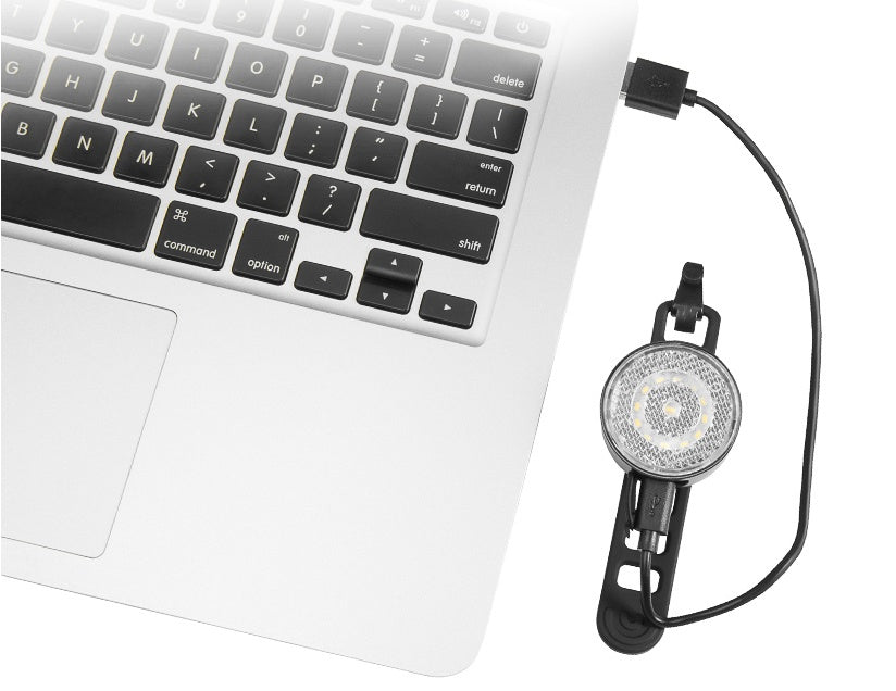 Laptop with a LED Light attached on a white background