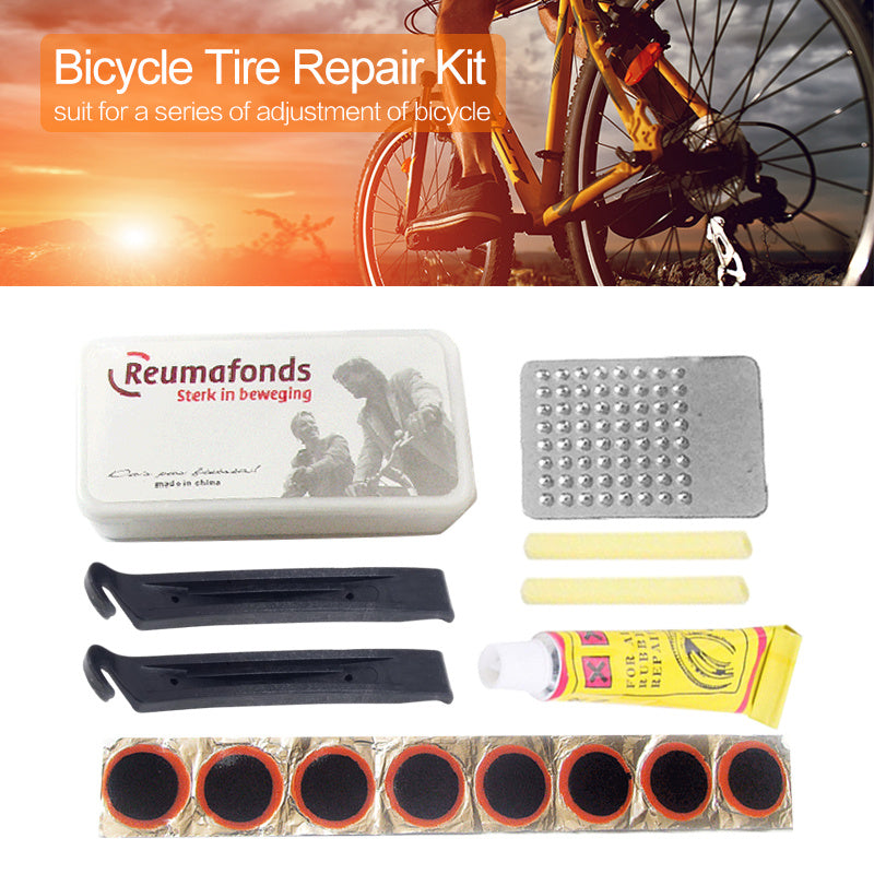 Bicycle tire repair kit with tools and components on a white background