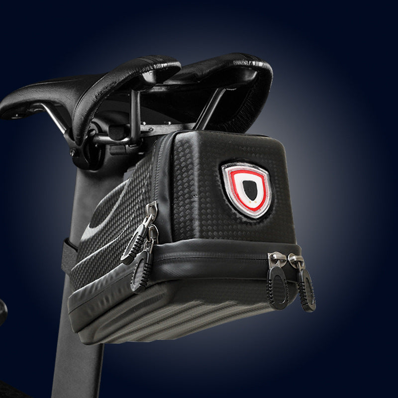 Black saddlebag with a rechargeable rear light on a dark background