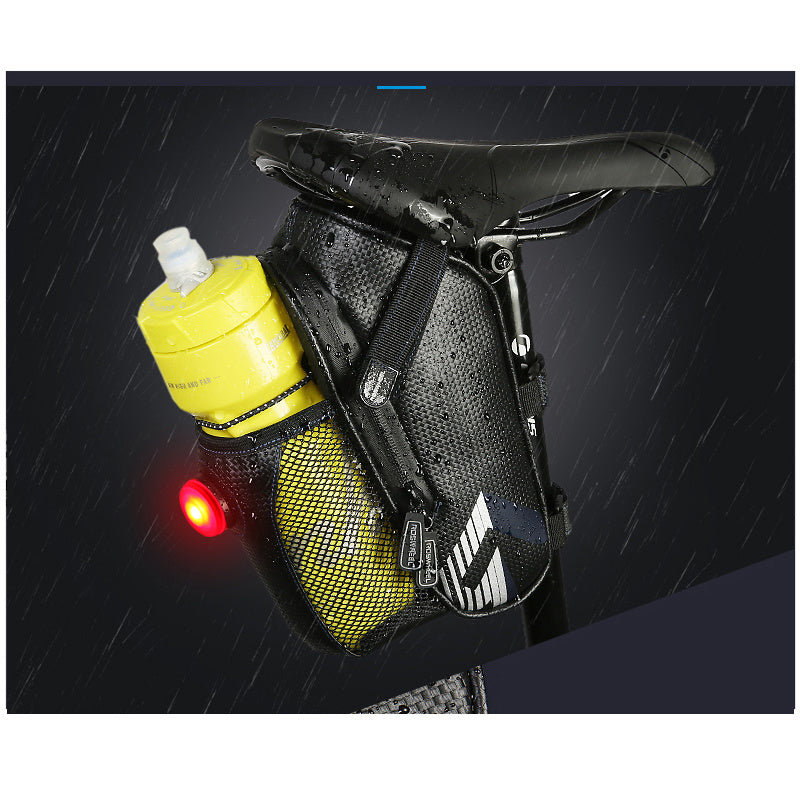 Bicycle saddle bag with yellow water bottle holder and red light on a dark background