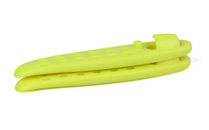 Yellow plastic bycycle tyre levers with a textured surface on a white background