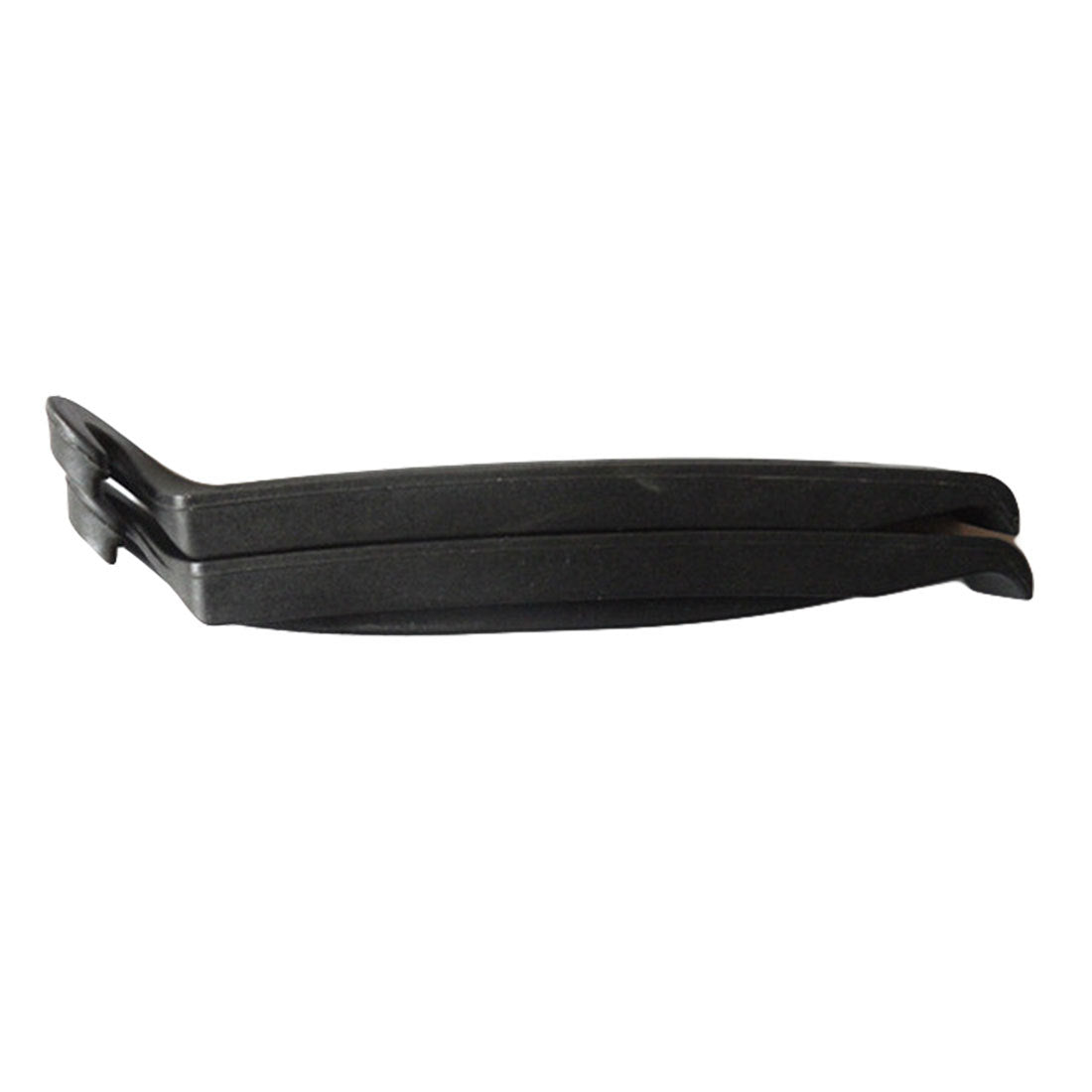 Black plastic tyre levers on a white background