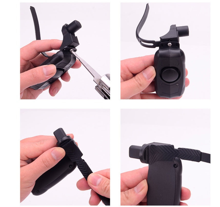 Black remote bicycle alarm with various attachments being demonstrated on a white background