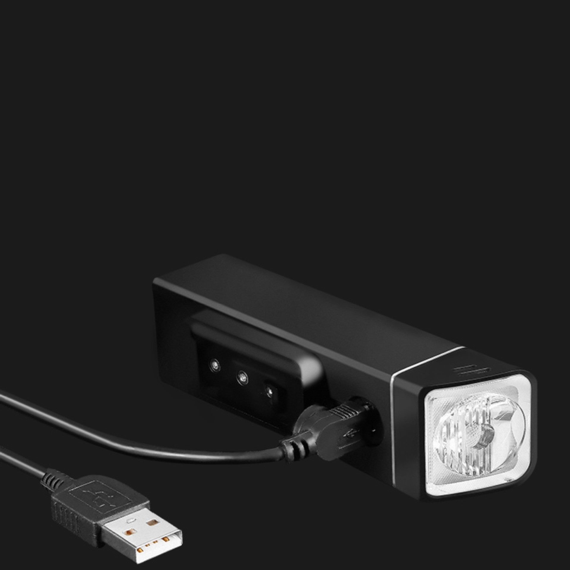 Black USB light with a cable on a black background