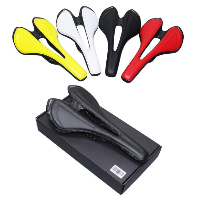 Set of carbon fibre bicycle saddles in various colours with a black saddle in a box on a white background