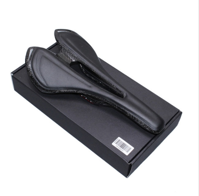 Black carbon bicycle saddle in a black box on a white background