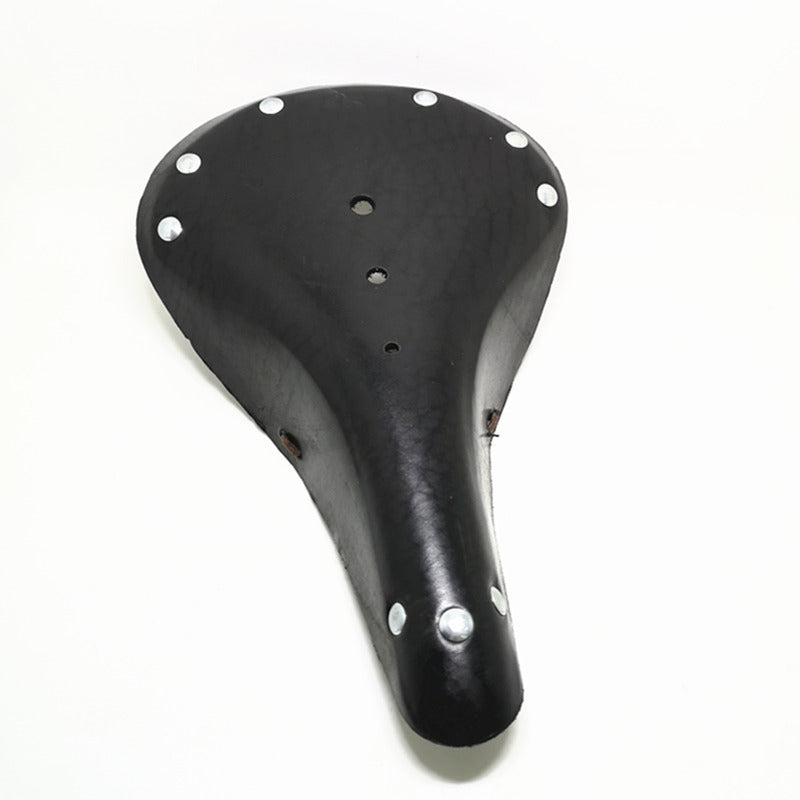 Black vintage design leather bicycle seat with silver rivets on a white background