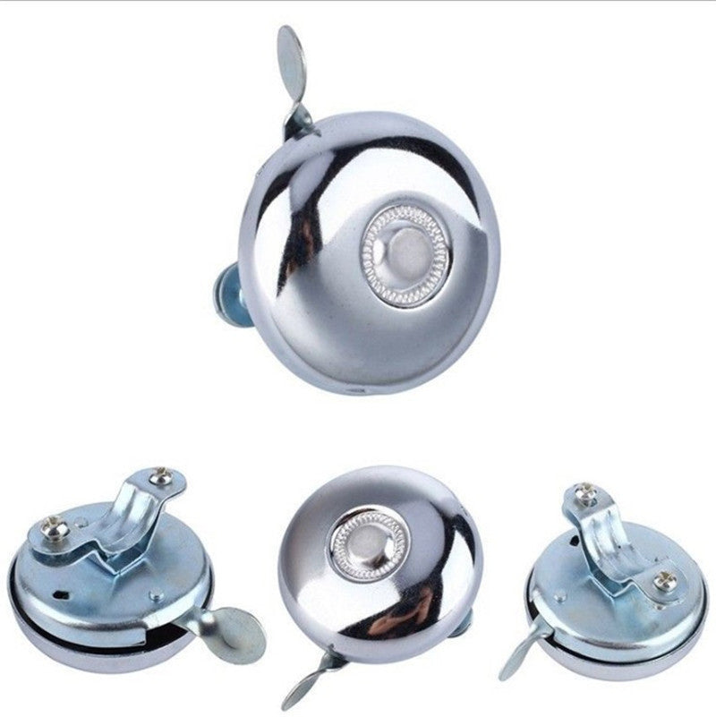 Set of four chrome bicycle bells on a white background