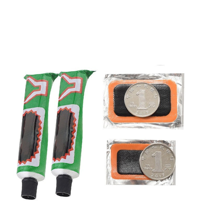 Two green tubes of adhesive and two bicycle tube repair patches with orange borders and silver coins on a white background.