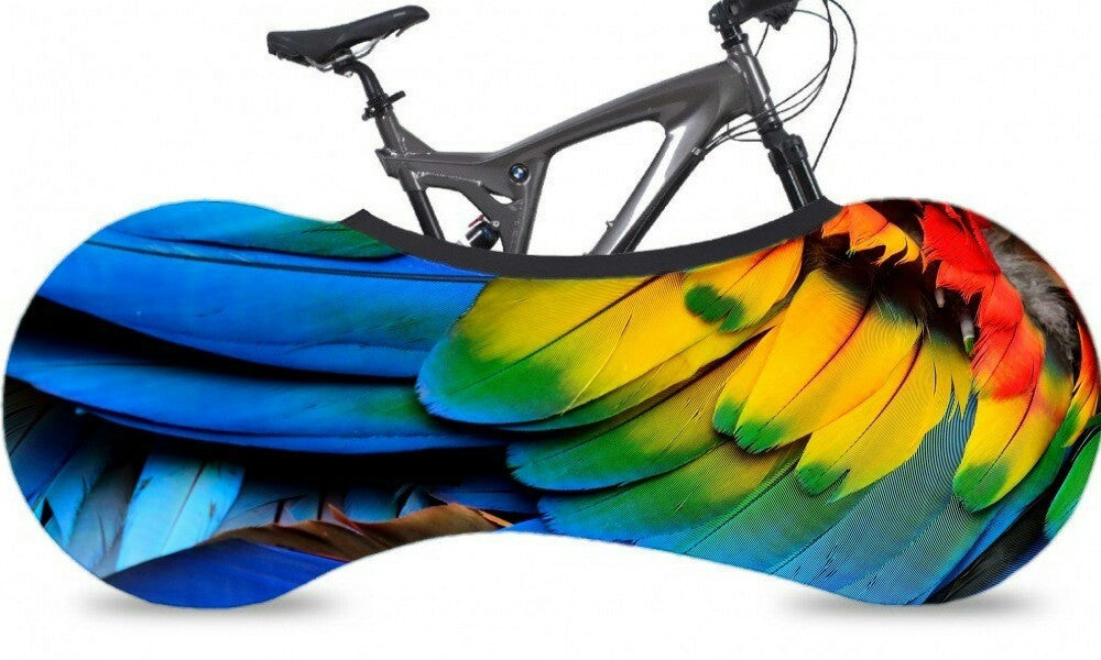 Bicycle with colorful parrot feather design cover on a white background