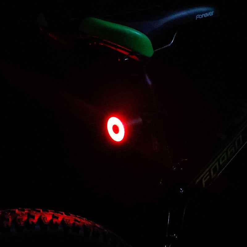 Bicycle tail light on a dark background