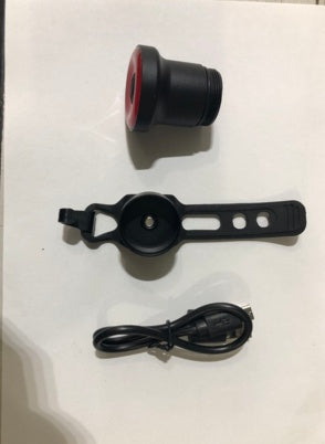 ENFITNIX Xlite100 Rear Bicycle Light with attached strap and power cable on a white background