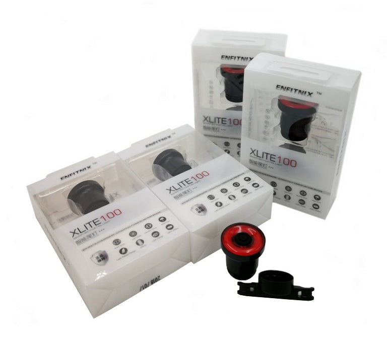 Multiple boxes of ENFITNIX Xlite100 Rear Bicycle Lights on a white background