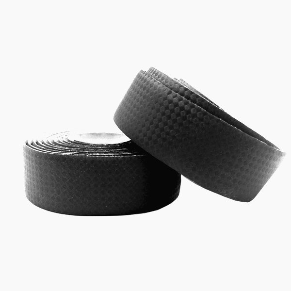 Two rolls of black EVA bicycle handlebar tape with carbon fibre finish on a white background