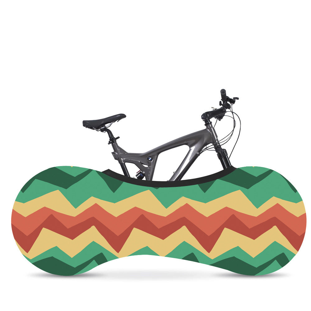 Bicycle with a colorful zigzag-patterned Elasticated Bicycle Dust Cover against a white background
