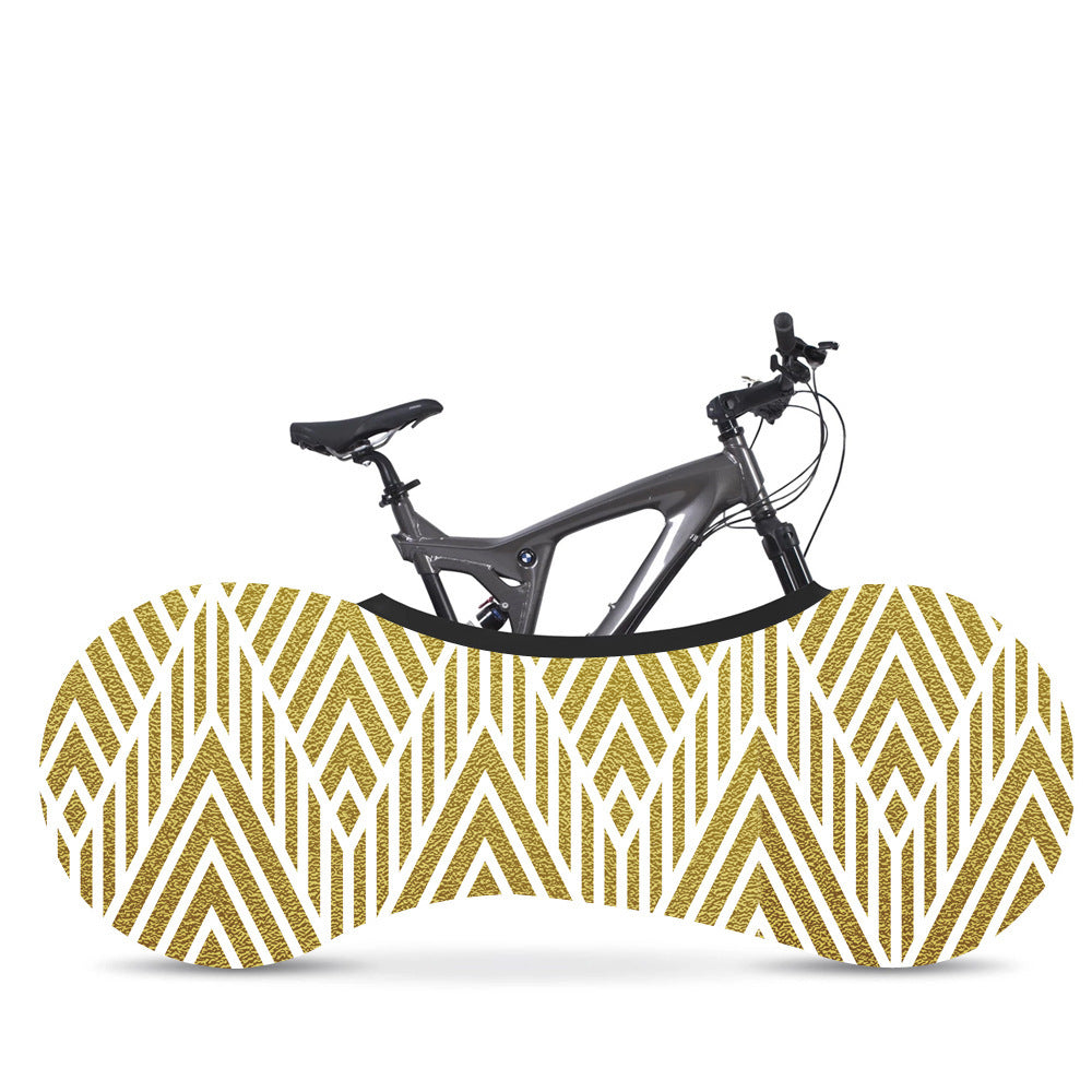 Bicycle with a gold and white patterned Elasticated Bicycle Dust Cover against a white background