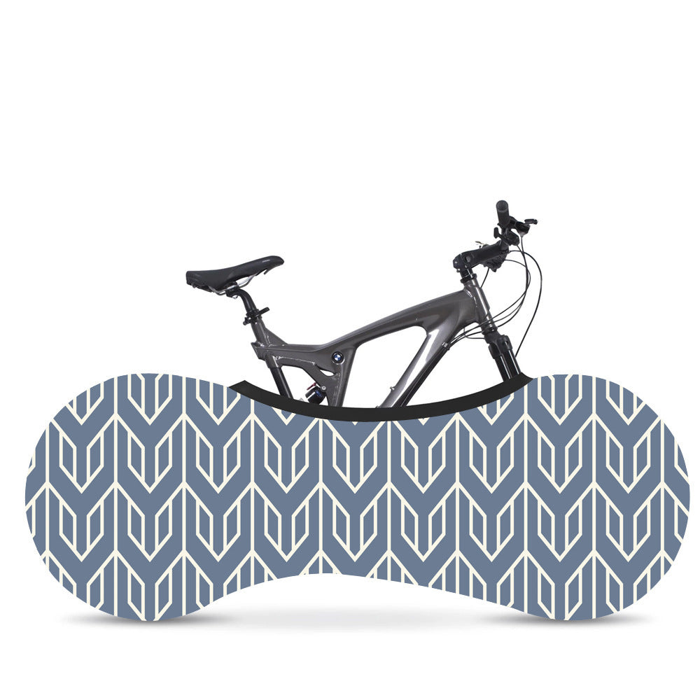 Bicycle with a blue geometric-patterned Elasticated Bicycle Dust Cover against a white background