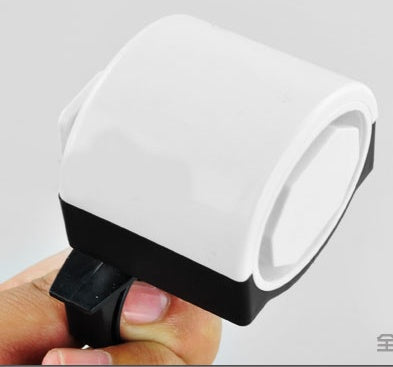 White and black electric bicycle horn held in a hand against a gray background