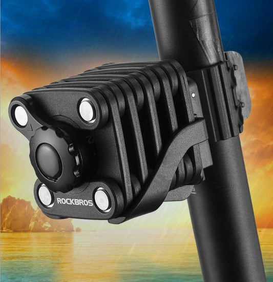 Black Extendable Bicycle Lock with 'RockBros' branding against a colorful mountain landscape background