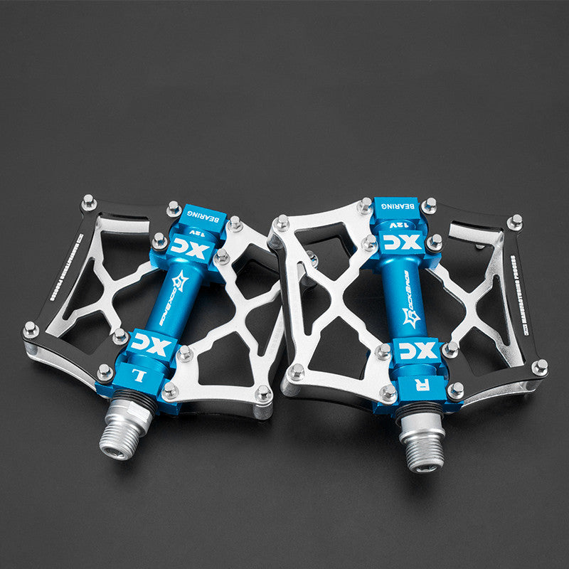 Pair of blue and silver pedals on a black background