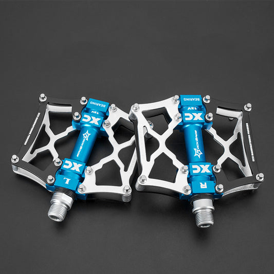 Pair of blue and silver pedals on a black background