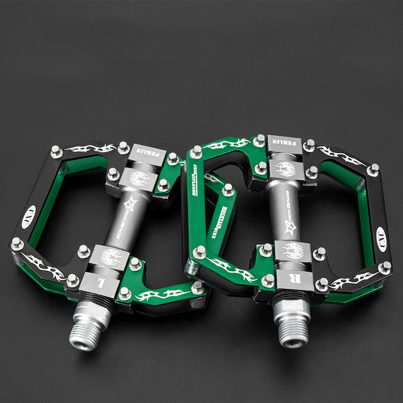 Green and silver Flat Aluminium Bicycle Pedals on a black background