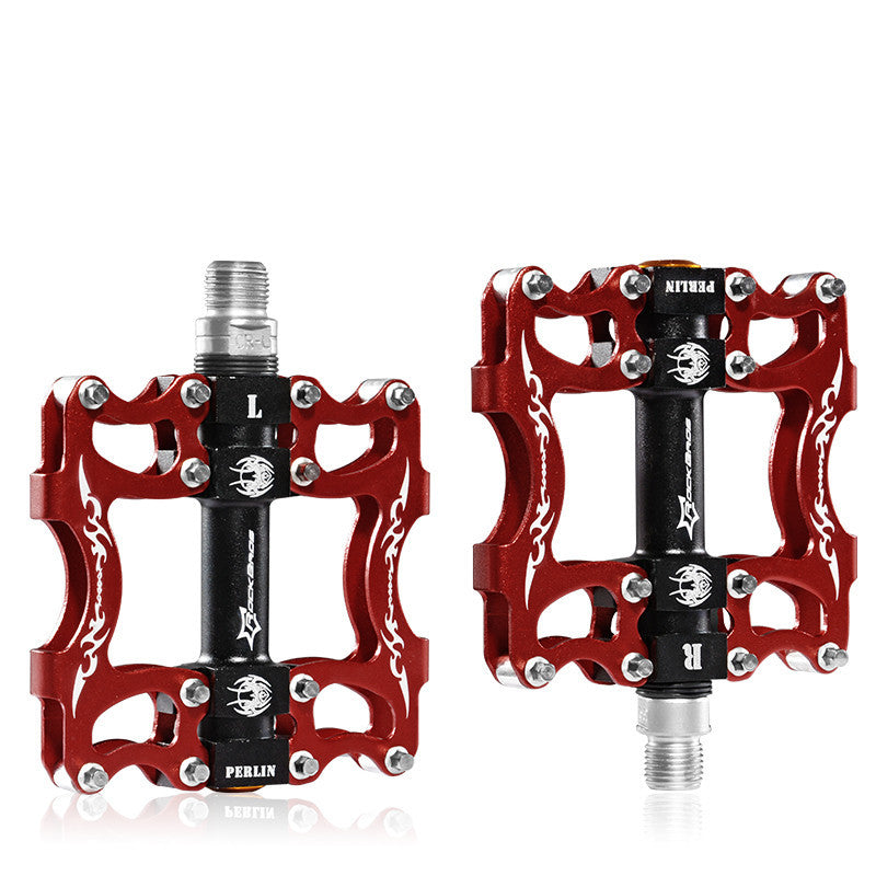 Red Flat Aluminium Bicycle Pedals with black axles on a white background